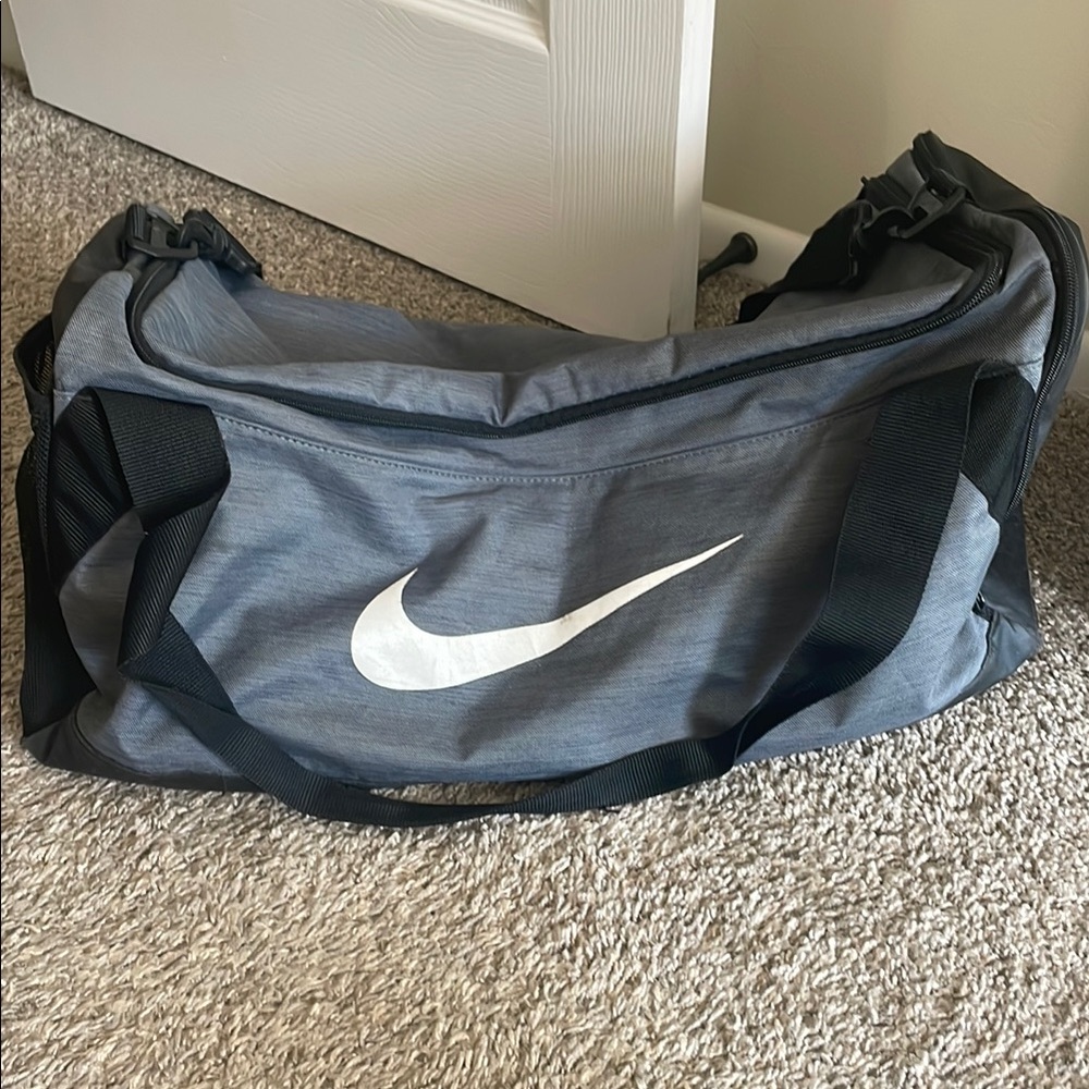 Nike Gray and Black Duffel Bag with Iconic Swoosh
